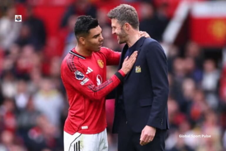 Michael Carrick England football legend and Manchester United manager applauding during a Premier League match at Old Trafford.