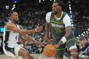 San Antonio Spurs vs Minnesota Timberwolves NBA game featuring players battling for possession during an intense basketball matchup.