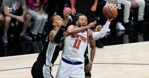 Jalen Brunson driving past Victor Wembanyama during game 5 nba finals matchup.